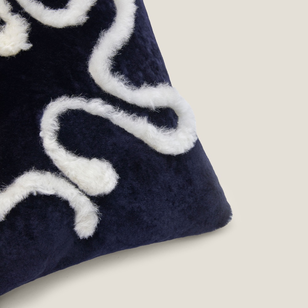 The details of a chic cushion hand-sewn by the seamstresses of the Norki workshop