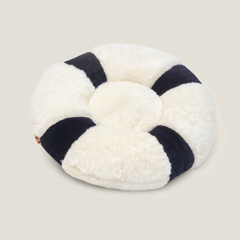 Coussin rond confortable, intérieur plumes.