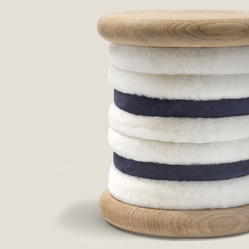 A luxury pouf like a spool of thread