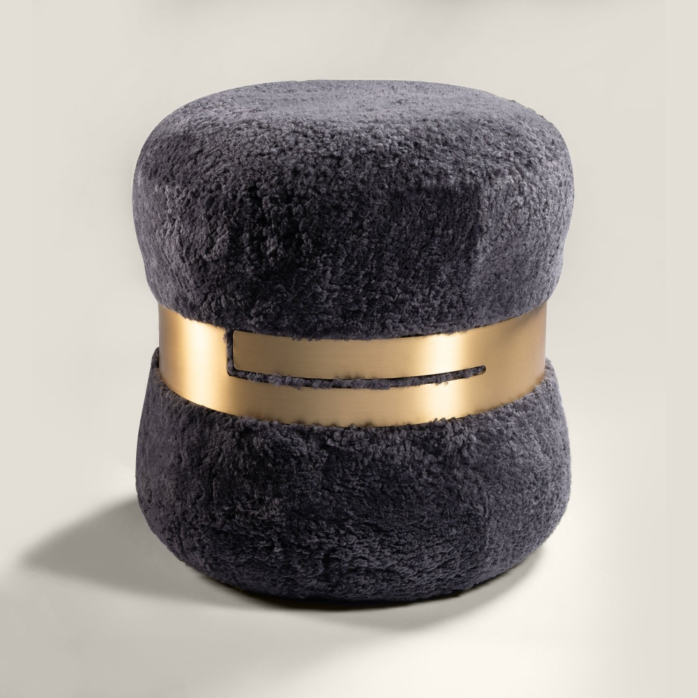 Norki stool in gray Australian curly lambskin with brass ring and high-end finish.