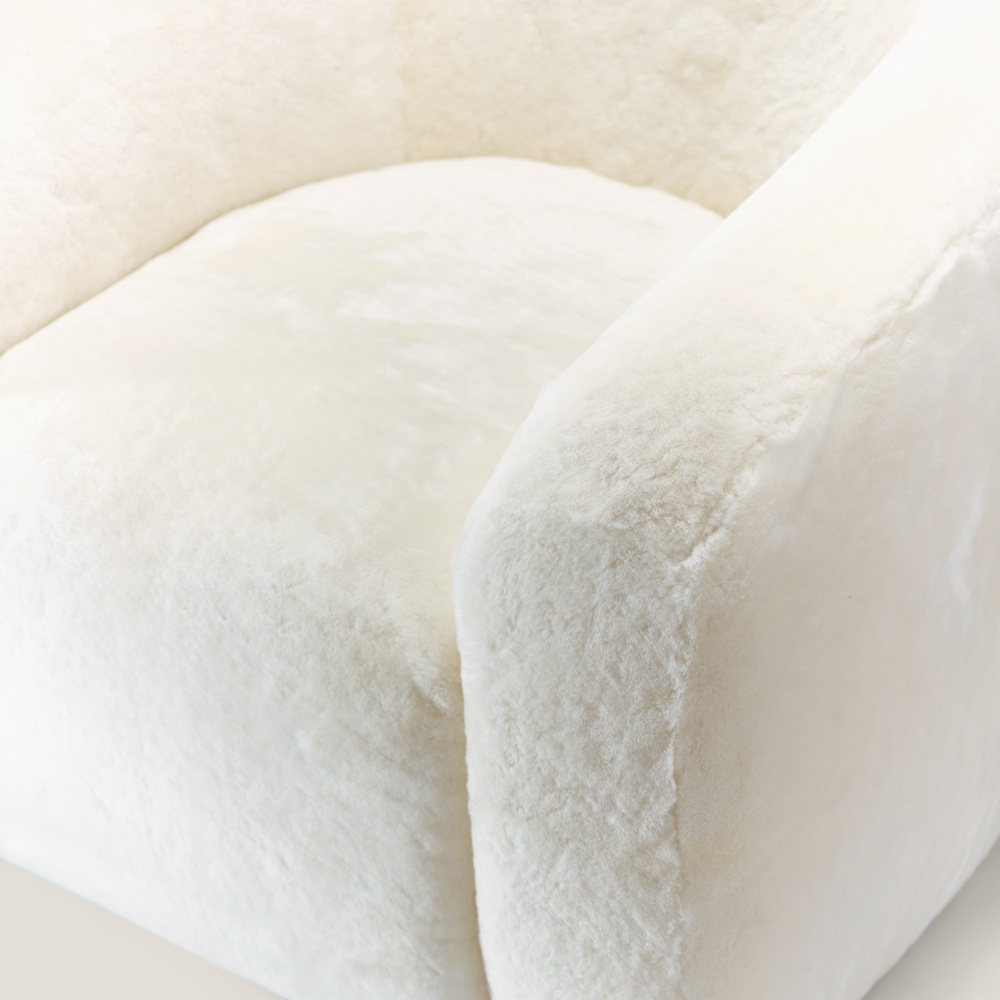 White armchair with incredible, luxurious haute couture finishes. Made in France in the NORKI workshop.