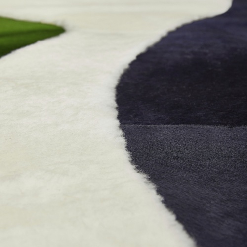 White sheepskin and blue and green cowhide for this chic rug with quality finishes