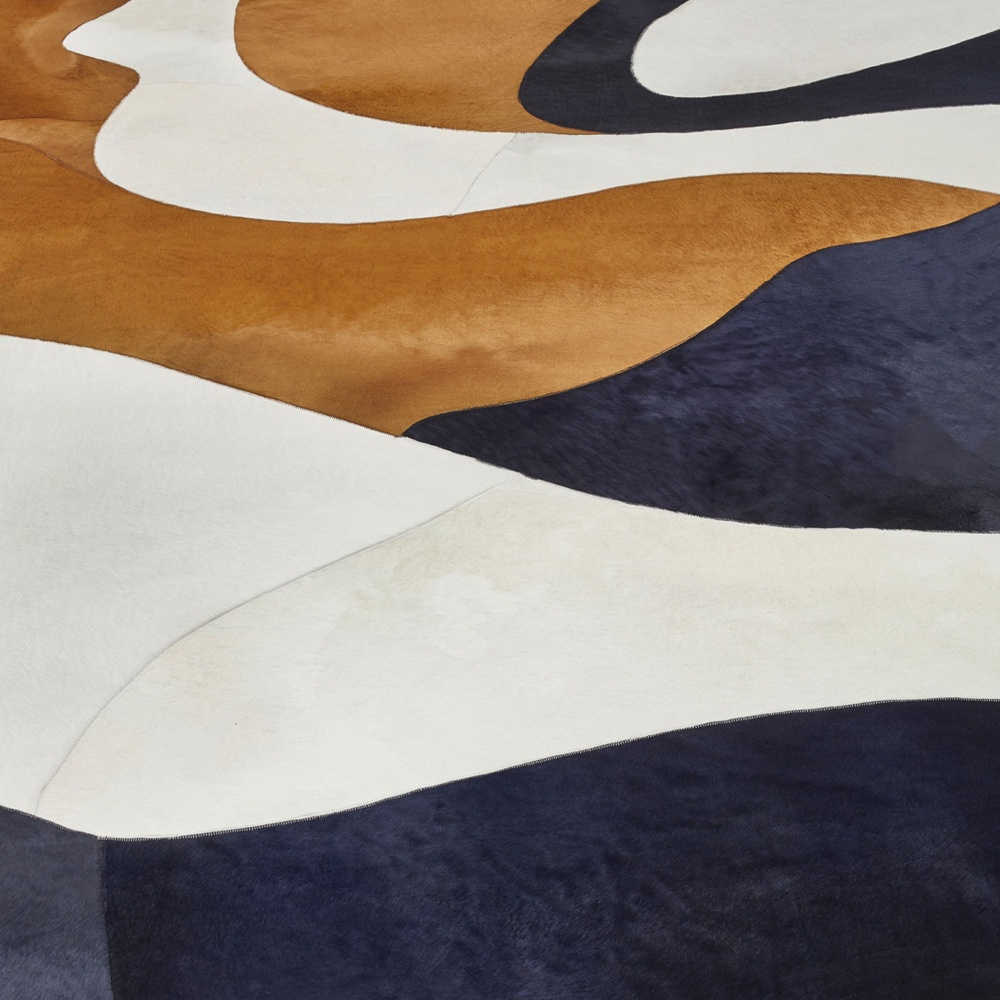 A designer rug with patterns that remind us of nature, the sea and the sky