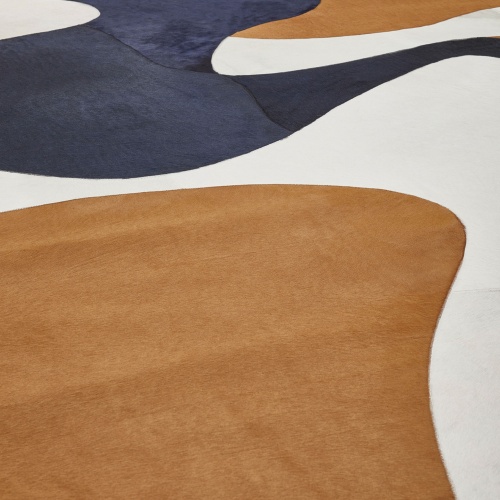 Cowhide is transformed into luxurious rugs under the expert hands of our artisans.