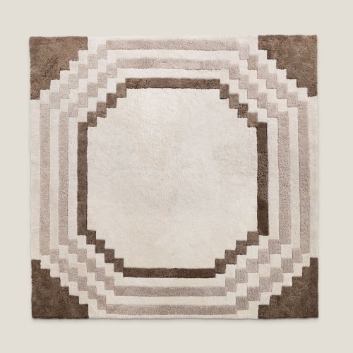 Square rug in natural hide with chic geometric patterns in a variation of beige