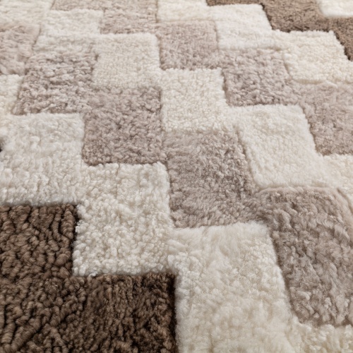 Noble and natural materials for this square rug with a classic repeating pattern