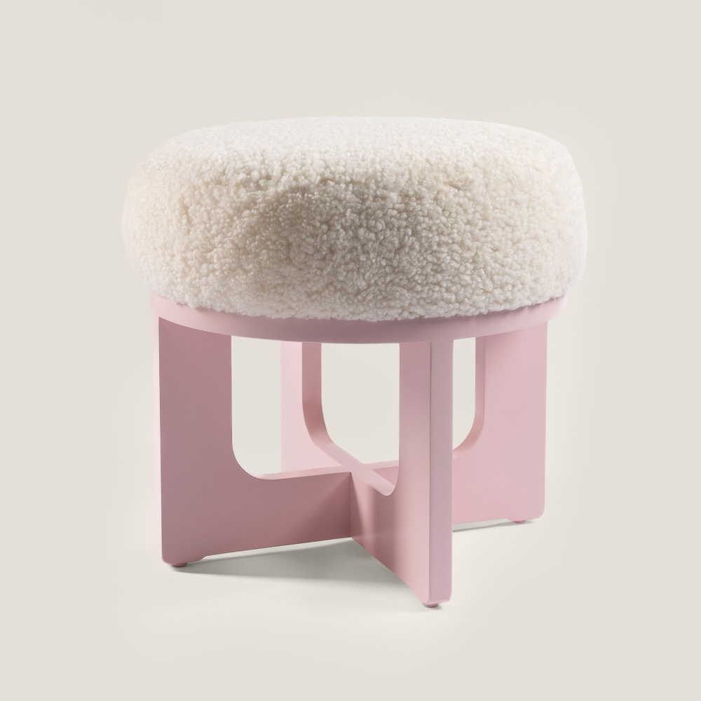 Buy a small round pouf to decorate a nursery or an elegant and feminine bedroom