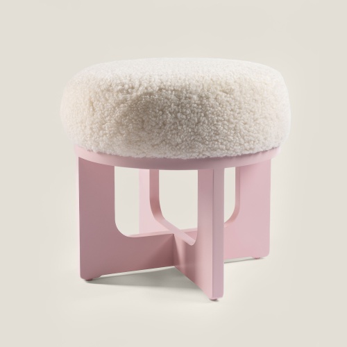 Buy a small round pouf to decorate a nursery or an elegant and feminine bedroom