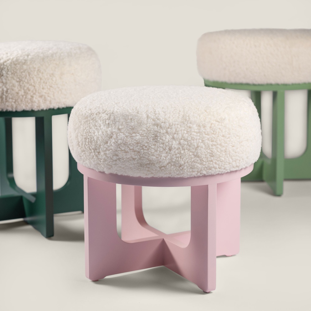 Small pastel pink lacquered wooden pouf, seat height 42 cm, comfortable white sheepskin seat by Norki