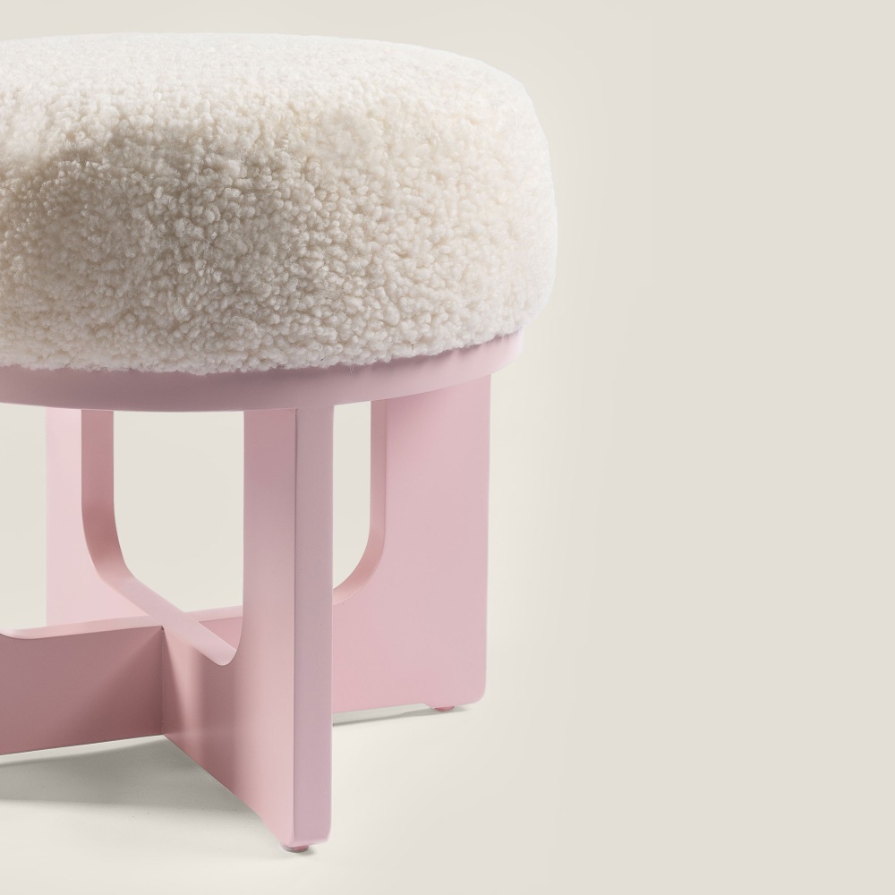 Elegant design, luxurious natural materials, pastel pink color for this small high-end pouf