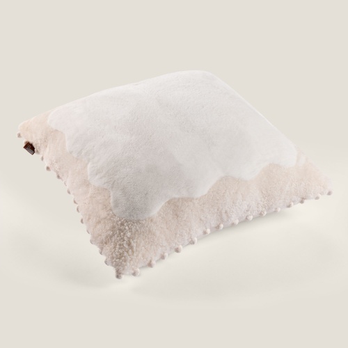 A square cushion in shearling and shaved mink.