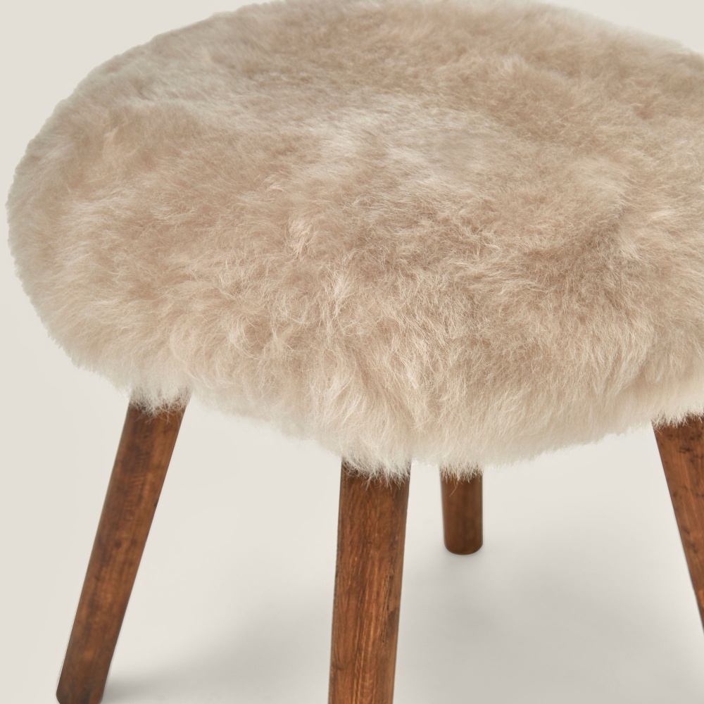 A stool in natural colours and authentic materials.