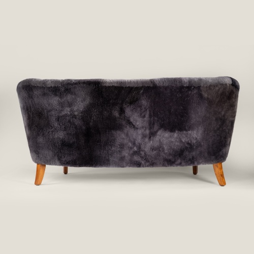 Small luxurious sofa in gray sheepskin, with an elegant design for your room