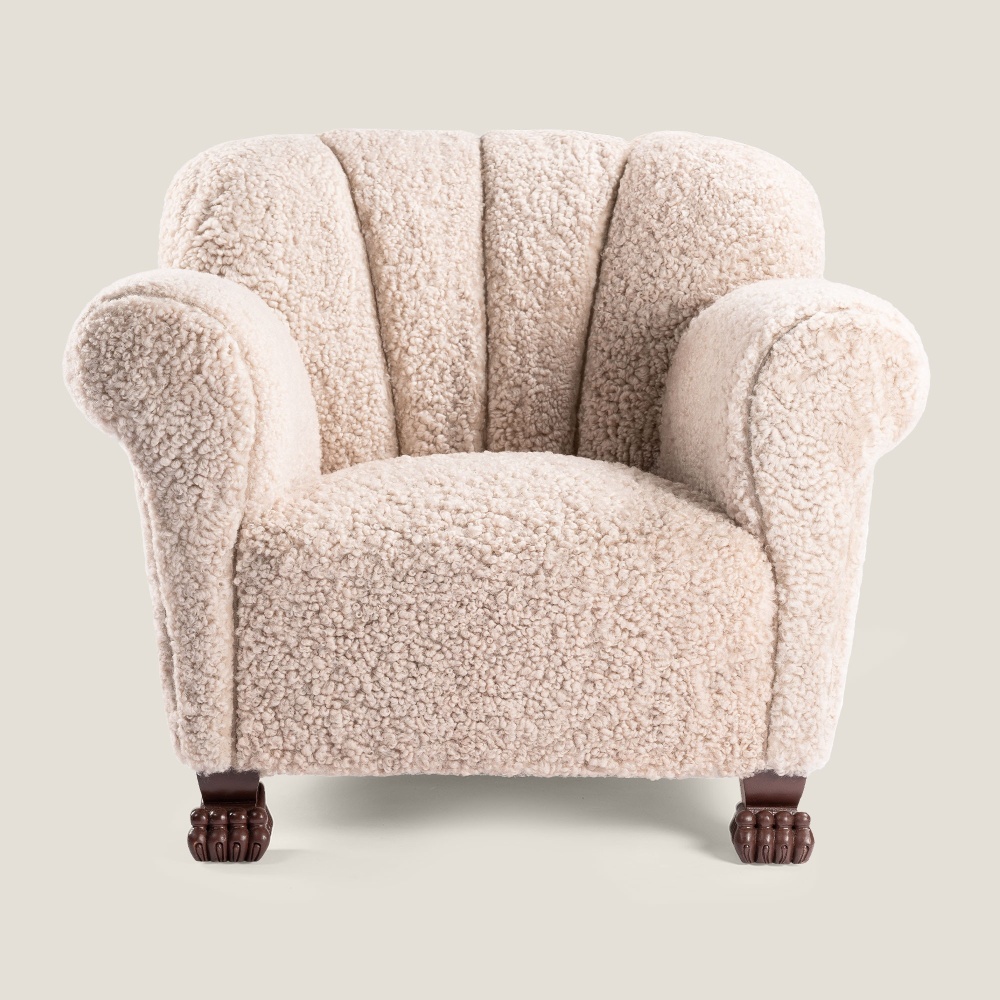 Majestic armchair in beige woollen skin, with animal paw feet.