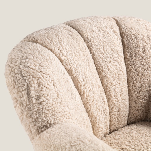 Seat upholstered in Oatmeal-coloured Australian curly shearling.