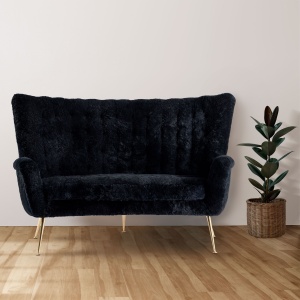 Small vintage black sheepskin sofa from Italy. Dimensions L 140 × H 80 × D 60 cm. Curation Norki