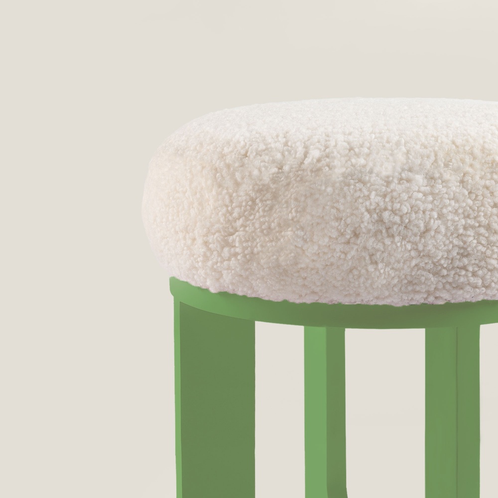 A comfortable, soft seat in natural white curly shearling.