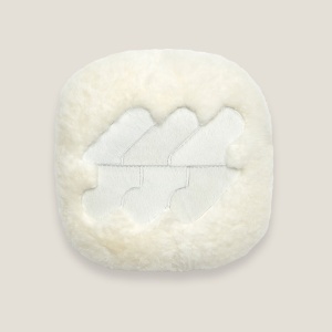 Quality white cushion with a pattern in the center and rounded corners made in France by Maison Norki