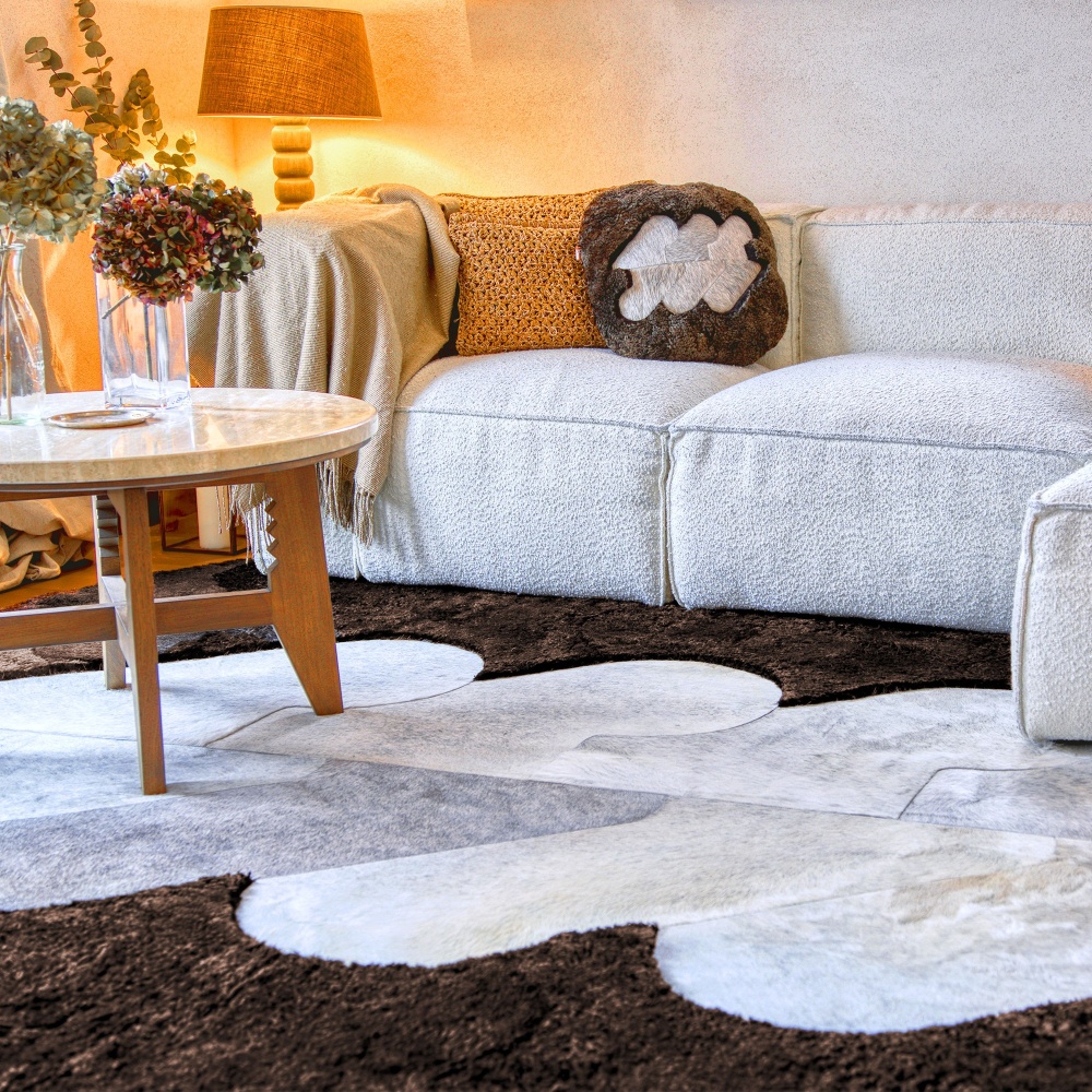 Brown cushion to match the rug from the same collection in luxurious leather and hide for decorating your chalet