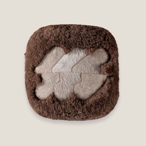 Chocolate-tinted Australian curly shearling cushion with a centered beige pattern by Norki