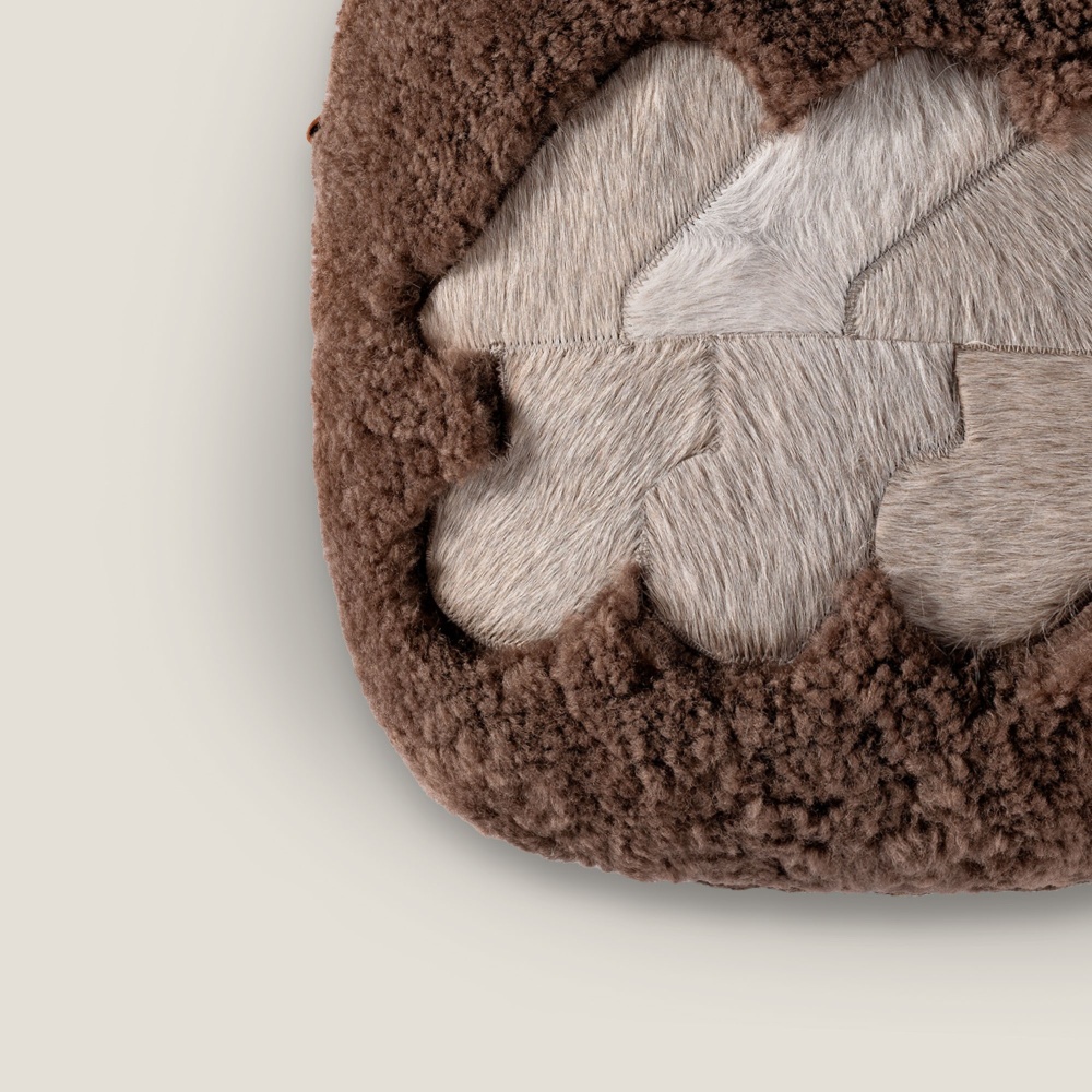 Chocolate Skin Cushion, rounded in the corners.