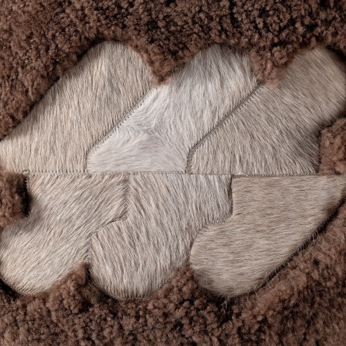 Beige and white heathered natural cowhide pattern.