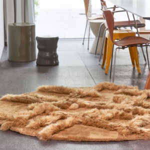 Round camel shearling rug with geometric relief pattern available to measure