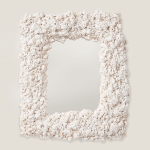 Mirror with an imitation popcorn frame.