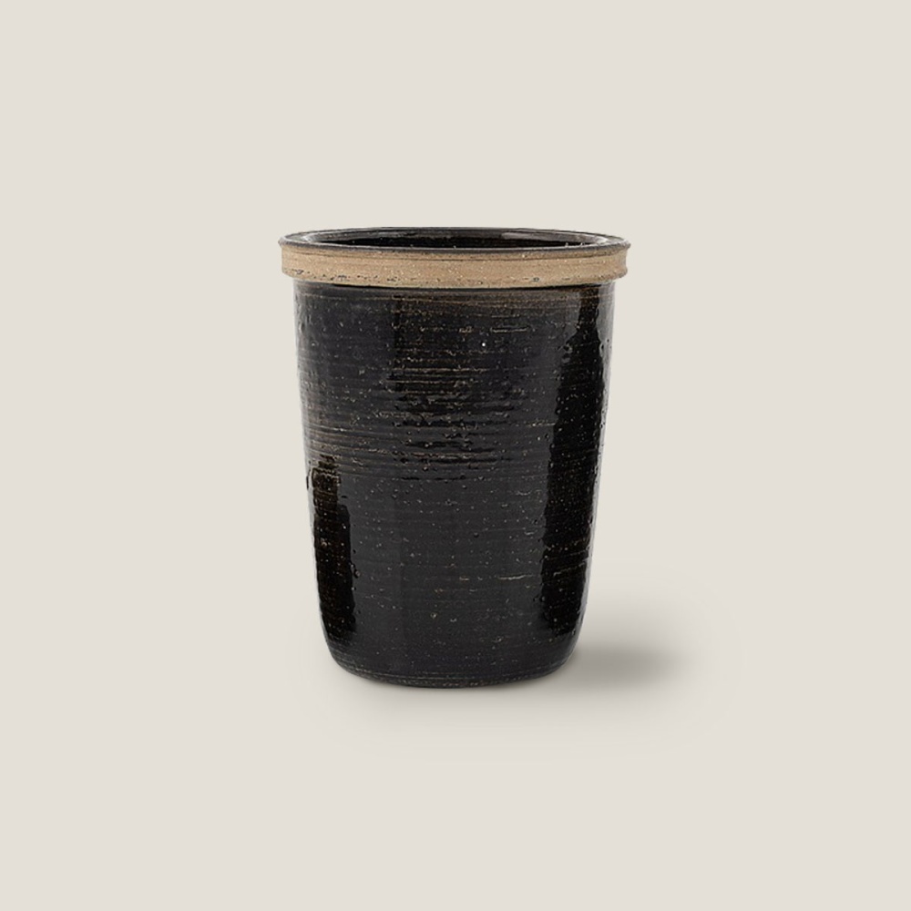 Decorative black vase sourced by Atelier Norki.