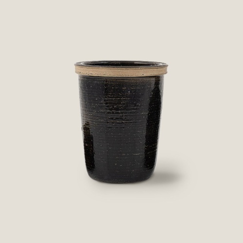 Decorative black vase sourced by Atelier Norki.