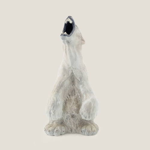 Vintage porcelain piece of a roaring polar bear.