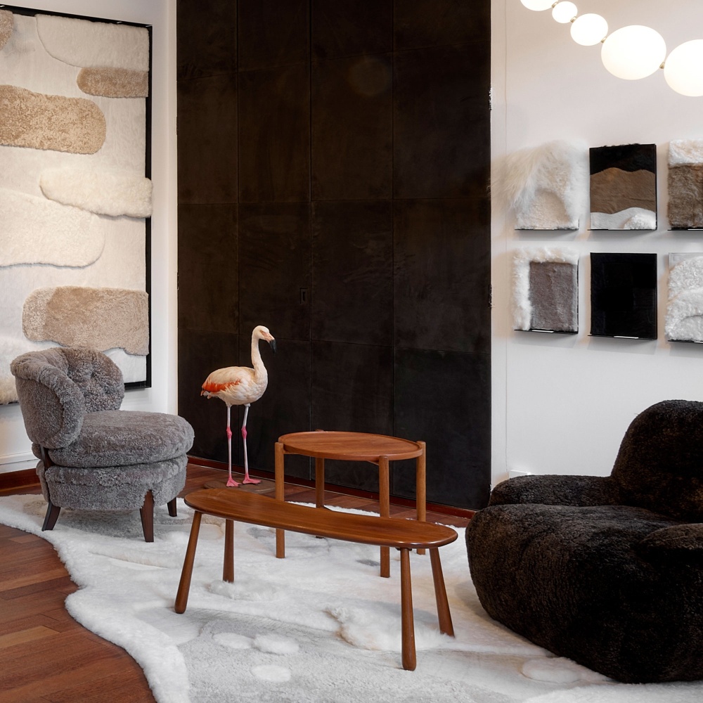 Vintage Scandinavian atmosphere with side tables and Otto Schulz armchair combined with a contemporary brown armchair