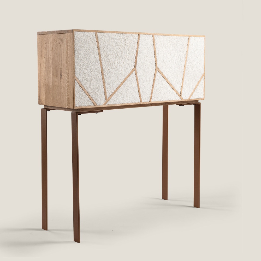 Luxurious contemporary designer furniture in solid wood supported by thin Corten steel legs.