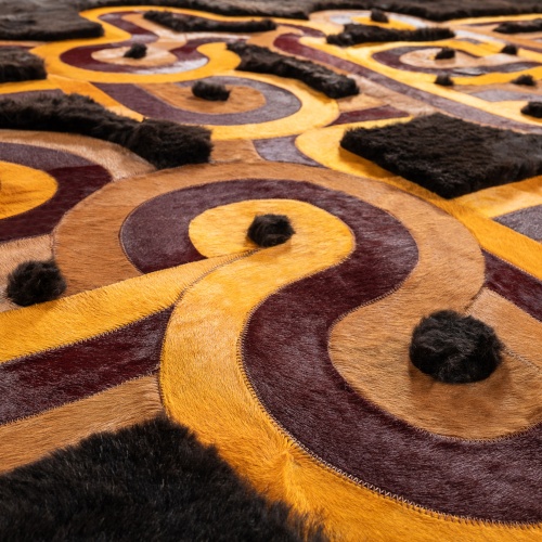 Multi-colored curved lines on a black background create a chic pattern for this living room rug