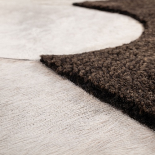 Rug made by hand in dark brown Australian curly shearling and grey mottled cowhide.