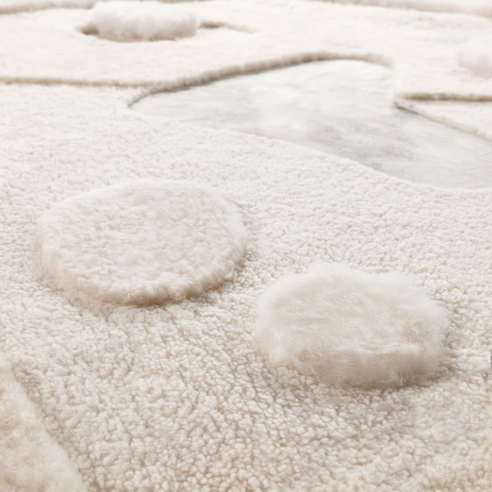 Rug in natural white sheepskin, natural white French curly shearling and natural white cowhide.