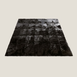 Large luxurious rectangular black rug in Tuscan lambskin available in 6,5 x 9,8 ft / 9,8 x 9,8 ft / 11,4 x 11,4 ft.