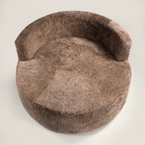 Grand canapé rond marron aux formes douces produit par Norki. Un sofa confortable pour le salon de votre chalet.