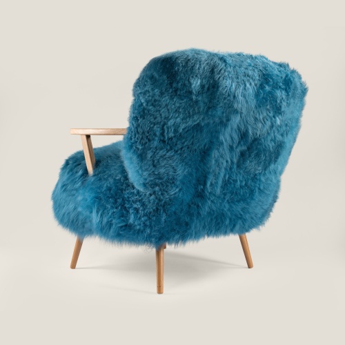 Large, comfortable blue armchair with a very contemporary design. Solid oak and sheepskin furniture made in France.