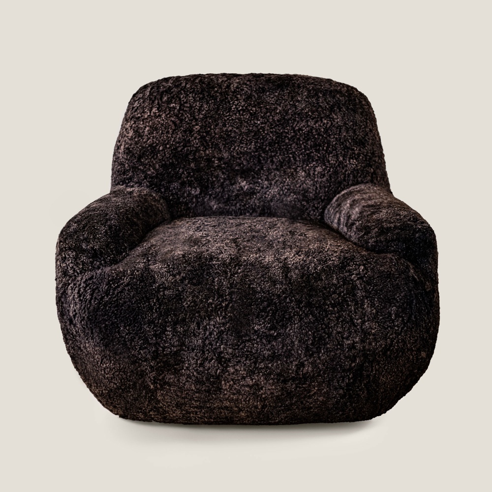 Maison Norki presents its Bao armchair, entirely upholstered in dark brown curly shearling in its French workshops.