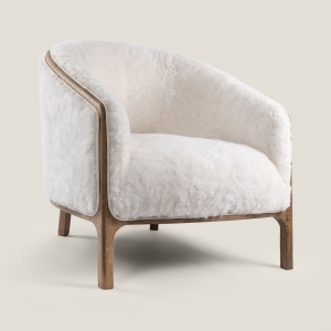 Comfortable bedroom armchair in natural white shearling. Luxurious high-end furniture available in black.