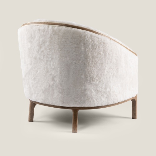 An elegant white armchair created by Ateliers Norki. A lovely piece to install in your living room for your comfort.