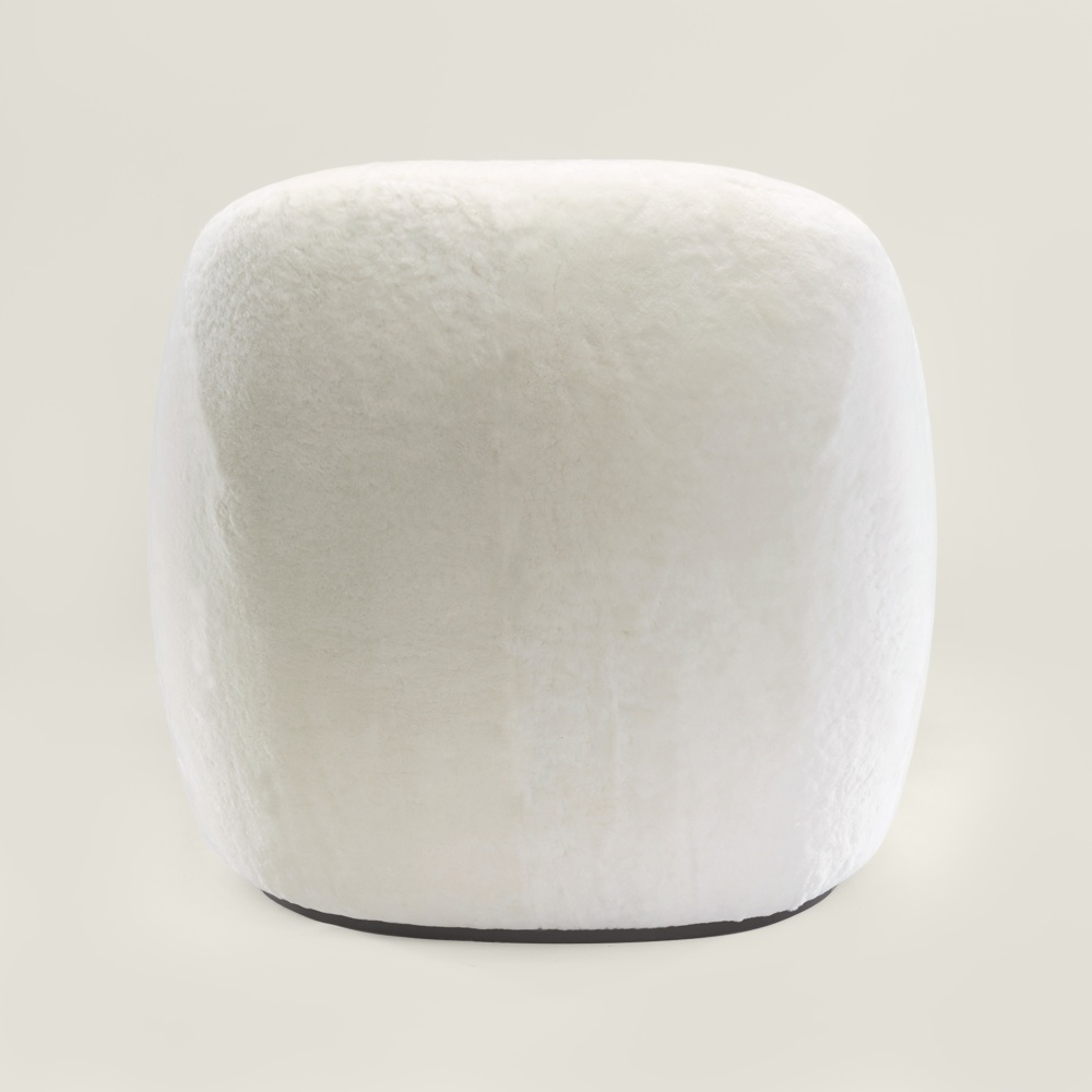 White armchair entirely upholstered in a luxurious, velvety-soft woolen hide. Made in France by Norki