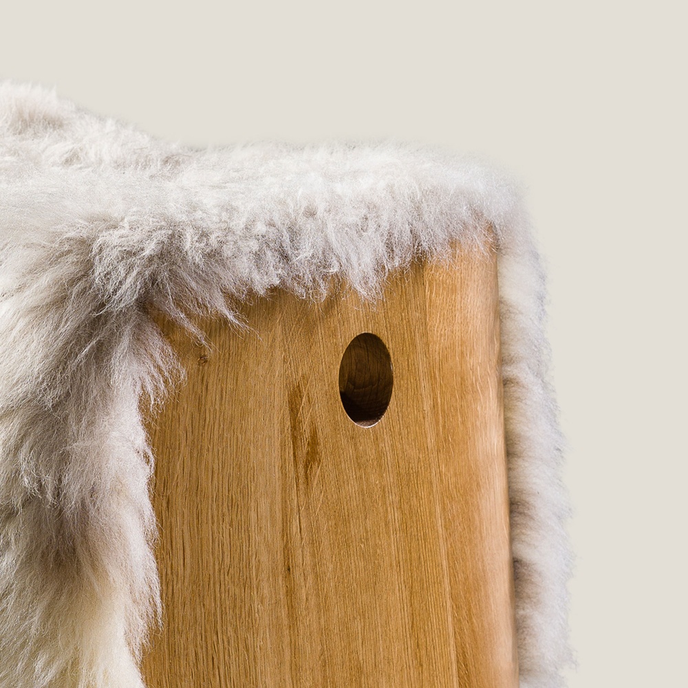 Small wooden stool with a nice seating in natural white sheepskin. Bespoke sizes and colours available.