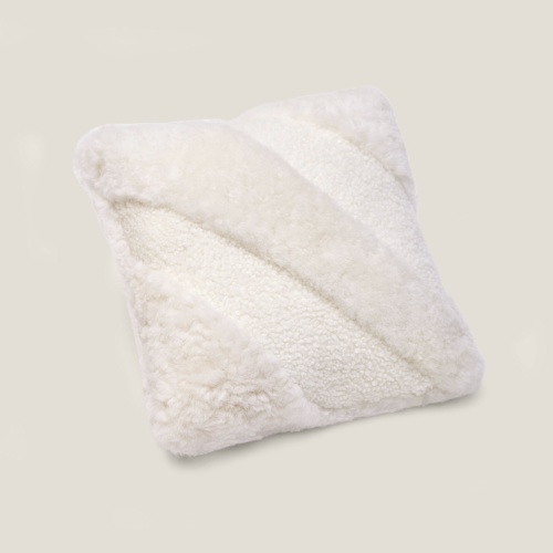 Elegant refined monochrome white cushion to decorate your bed or to bring comfort to your sofa