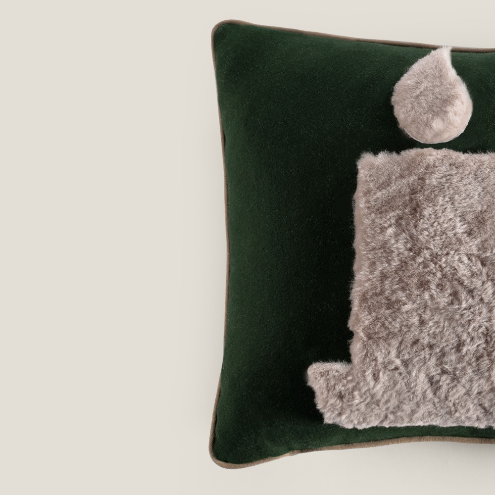 Decorate the sofa in your living room with large chic dark green and light gray cushions