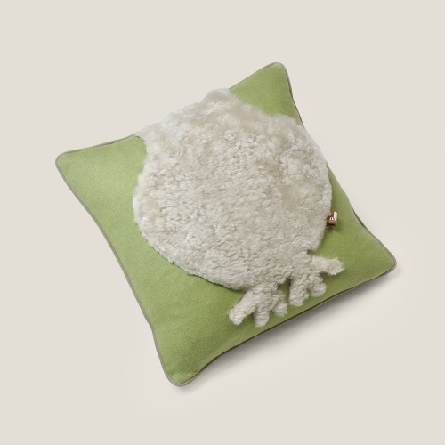 Very soft and comfortable cushion with an abstract sheepskin bird pattern