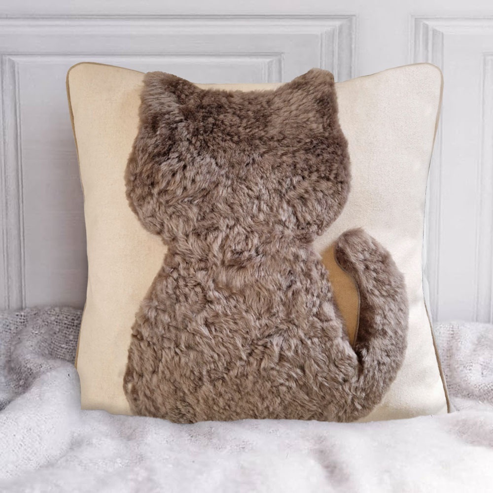 Luxurious children's cushion with an abstract pattern of a little cat in shearling