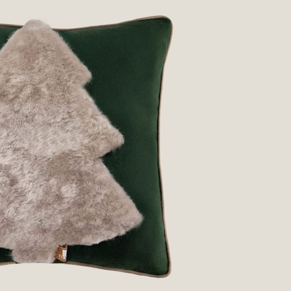 Green wool cushion with an abstract fir tree pattern application in shearling