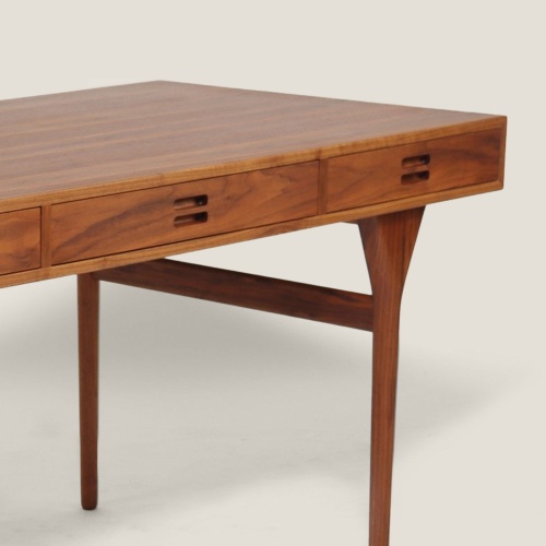 Furniture with clean lines, in veneered walnut.